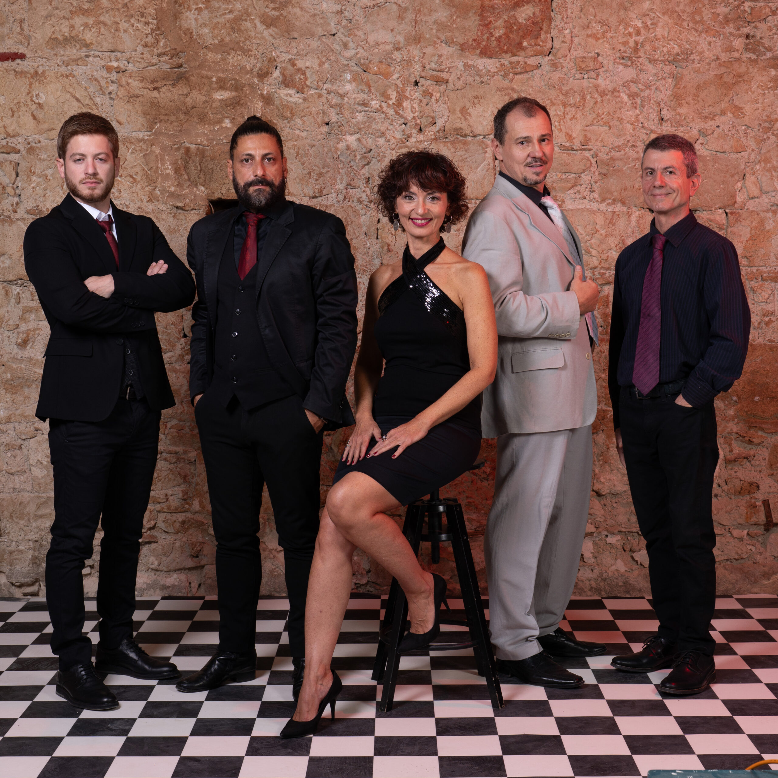 The five-piece band on the chequerboard floor